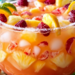 Ultimate Strong Party Punch served in a large punch bowl with colorful fruit slices and ice, perfect for celebrations.