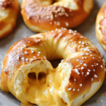 Warm, golden cheese-stuffed pretzels with a soft, chewy texture and gooey cheese filling.
