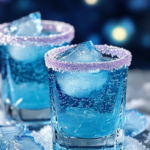 Ice Queen Shots with a frosty blue hue served in chilled shot glasses, topped with shimmer or sugar rims.